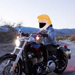 Trumpy Helmet Cover Costume on a bike